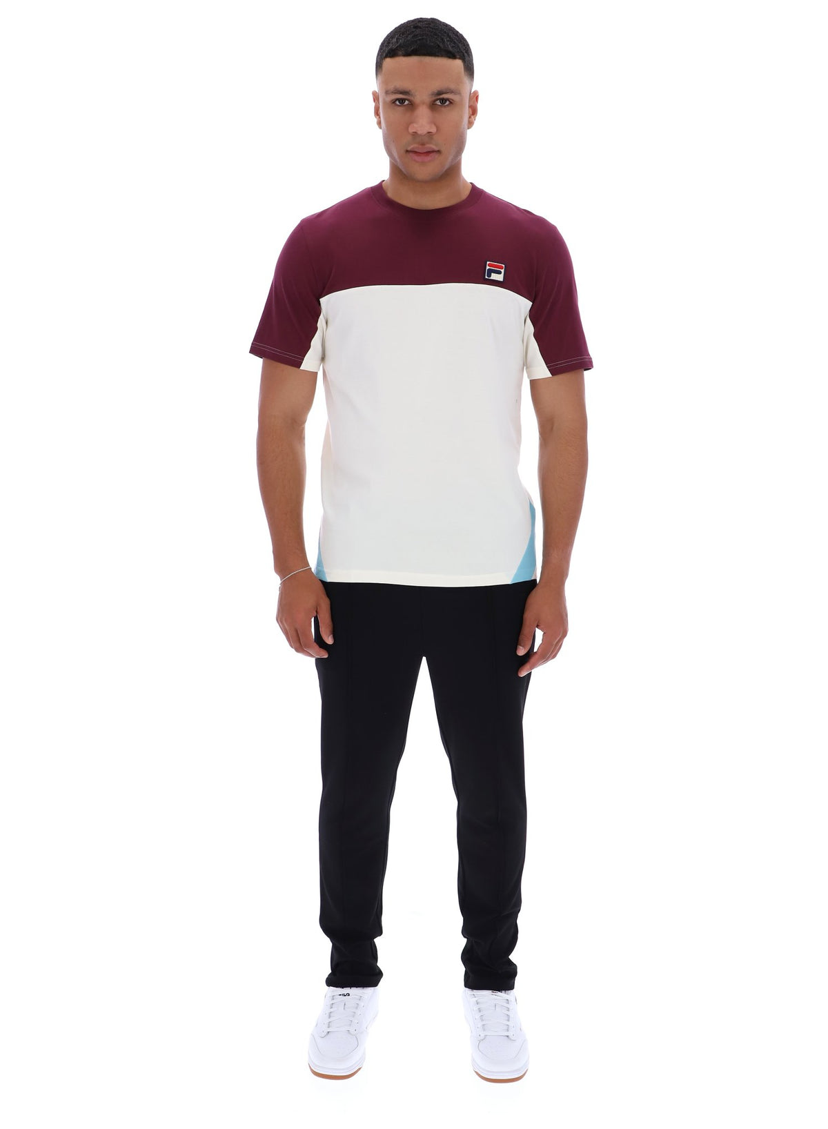 Displays a model wearing Fig Tiebreaker 'FILA' branded Colour Block T-Shirt