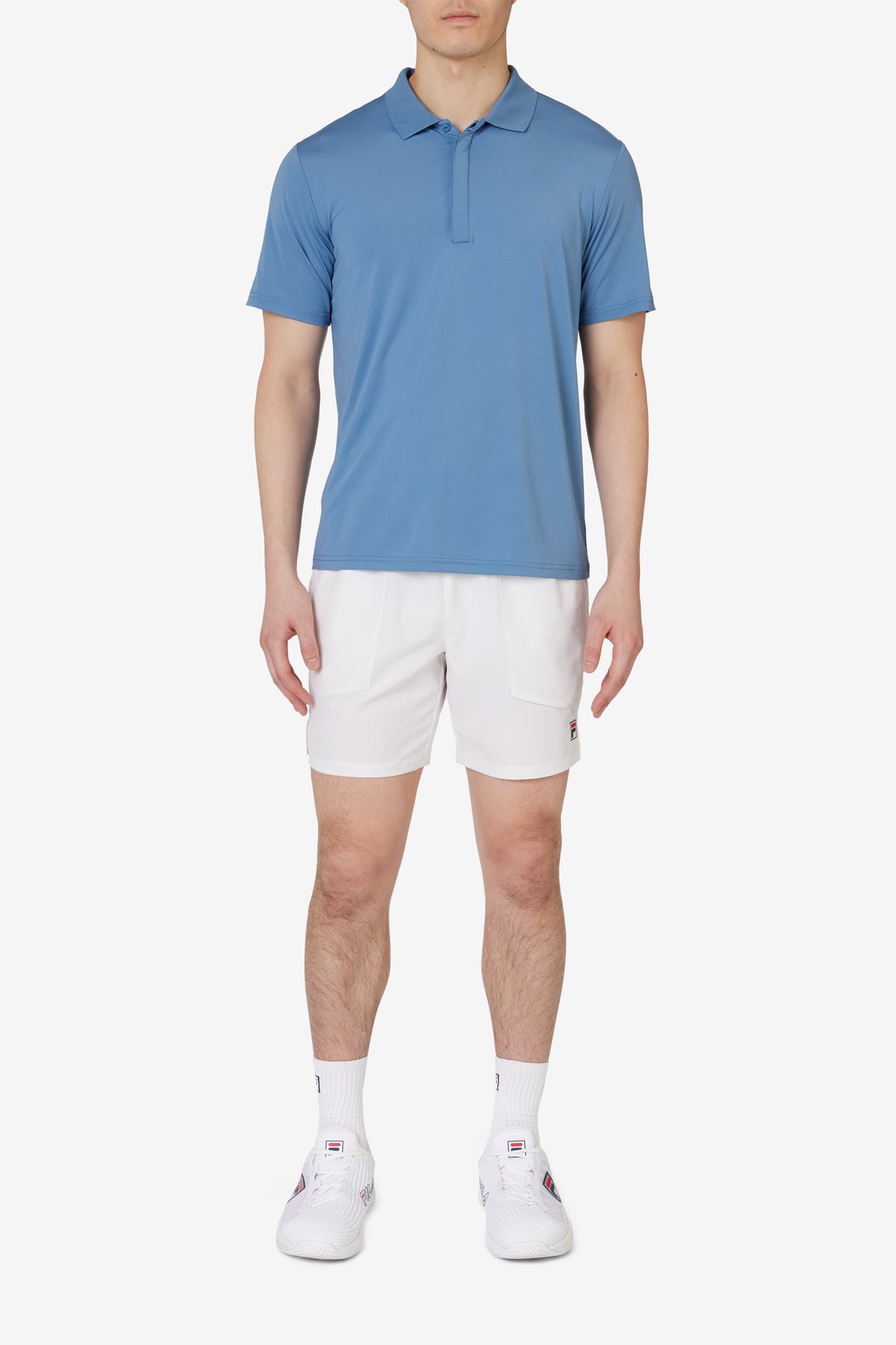 Displays a model wearing the Blue 'FILA' branded Tennis Essentials Top