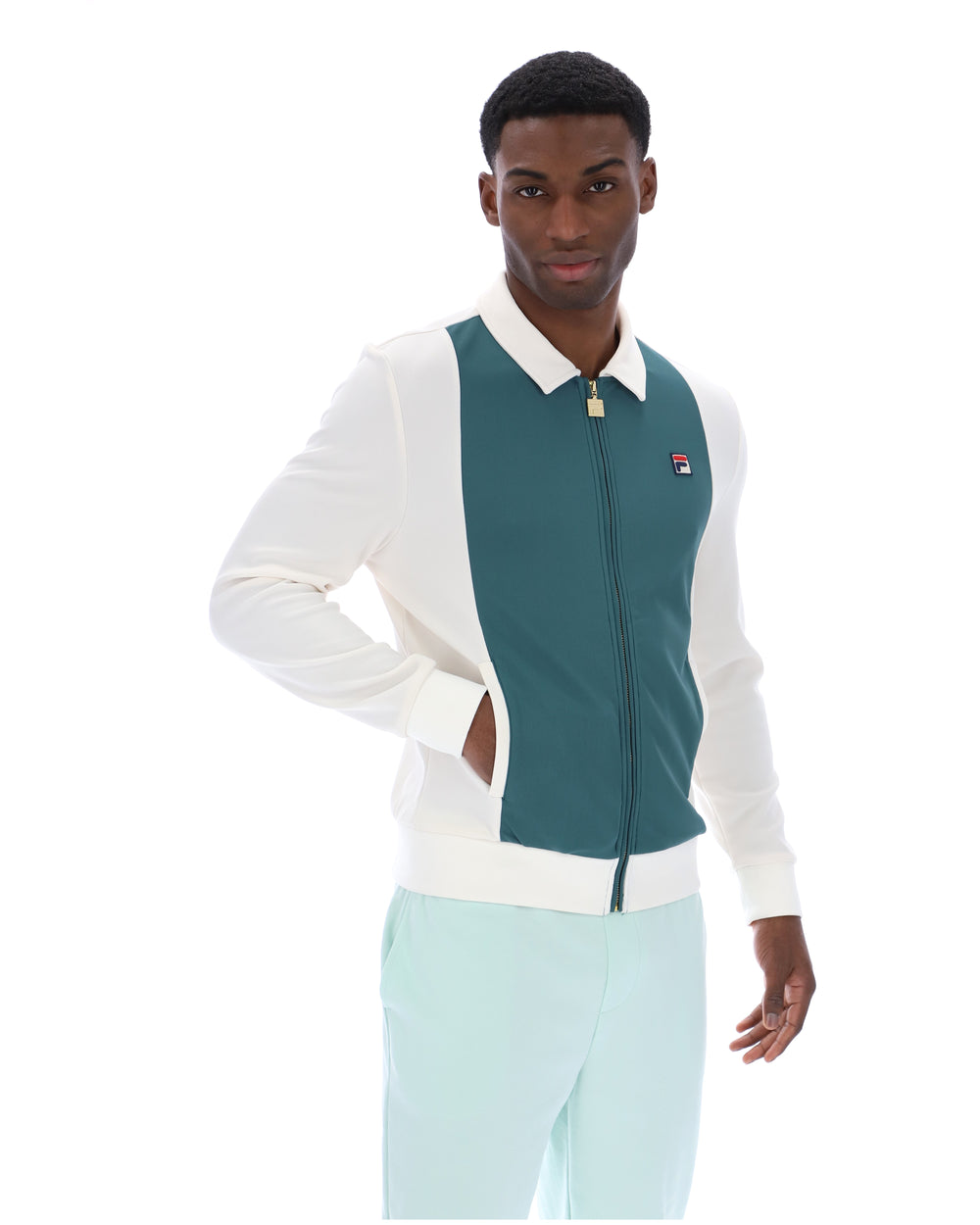 Man wearing a white and teal jacket with a visible brand logo on a white background