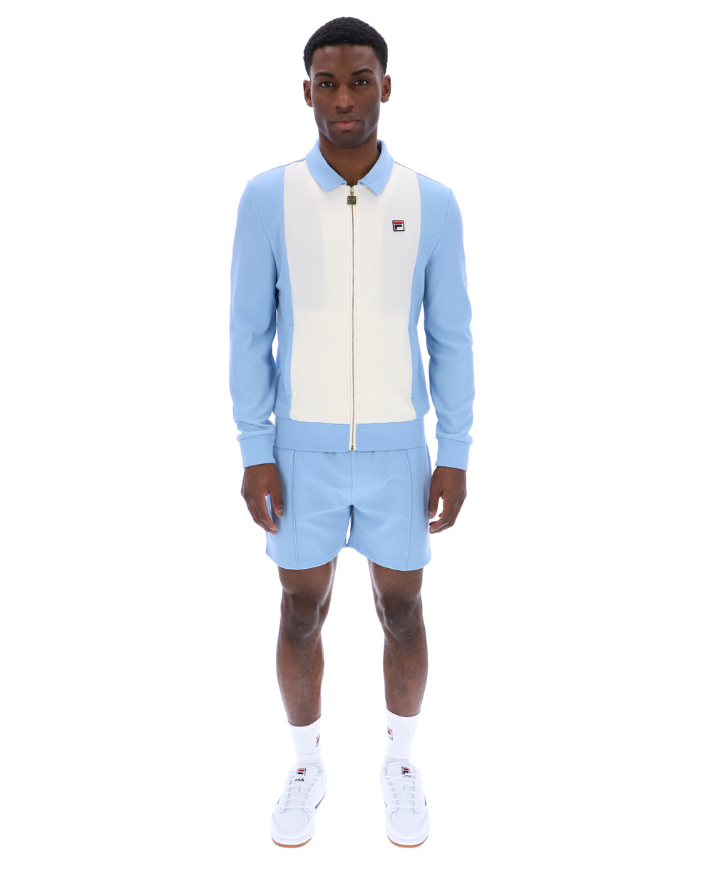 Light blue and white tracksuit with a visible brand logo on a white background