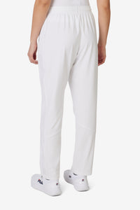 Displays a model wearing the White 'FILA' branded Tennis Advantage Track Pant