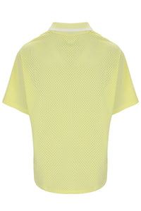 Yellow textured polo shirt on a white background
