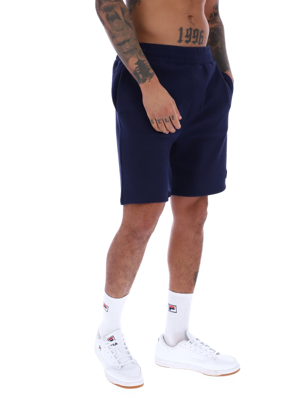 Displays a model wearing the Navy 'FILA' branded Vico Fleece Short