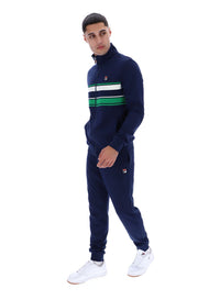 Displays a model wearing the Navy 'FILA' Vinnie Track Top