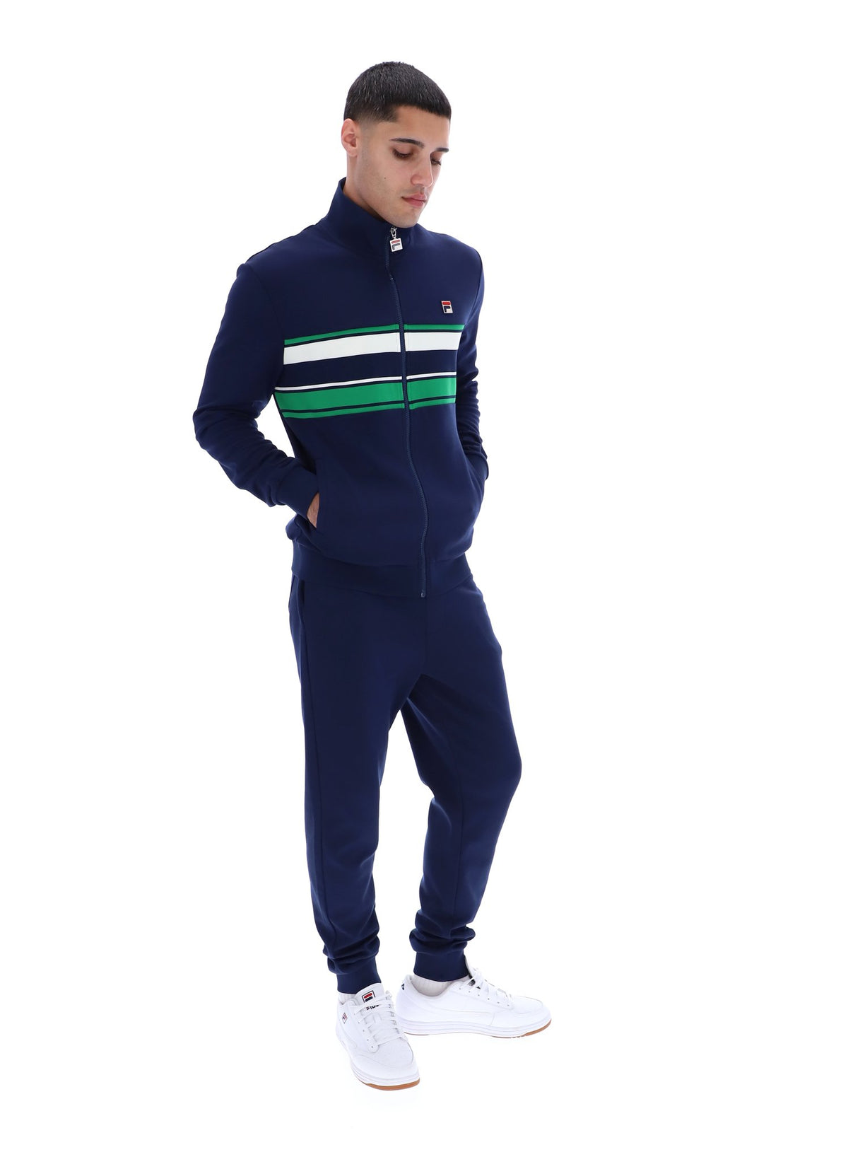 Displays a model wearing the Navy 'FILA' Vinnie Track Top
