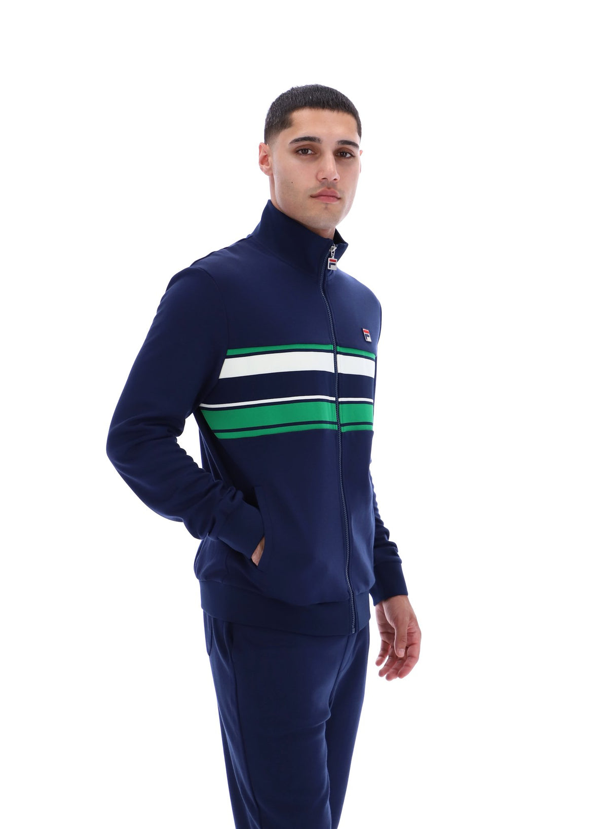 Displays a model wearing the Navy 'FILA' Vinnie Track Top