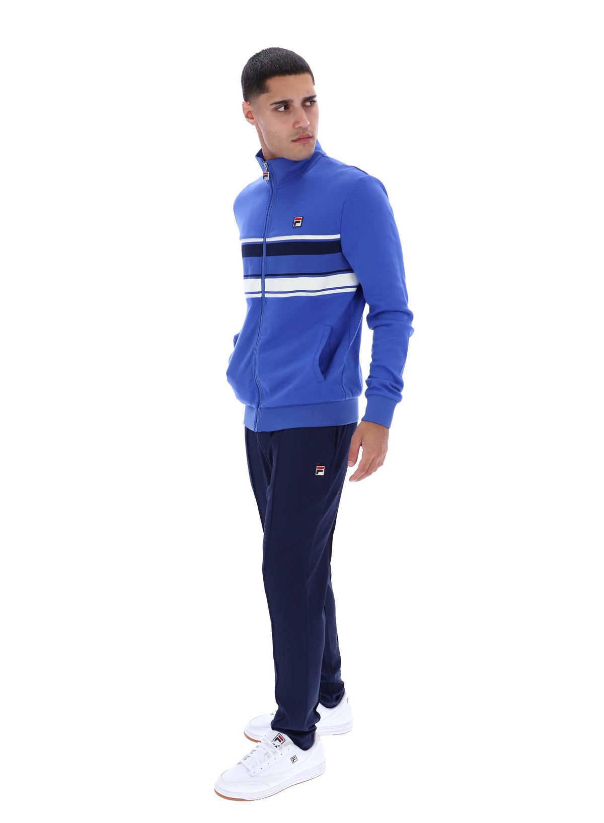 Displays the model wearing the Dazzling Blue 'FILA' branded Vinnie Track Top