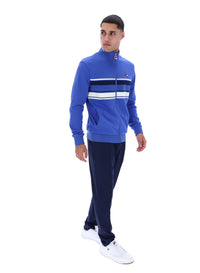 Displays the model wearing the Dazzling Blue 'FILA' branded Vinnie Track Top