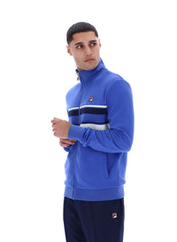 Displays the model wearing the Dazzling Blue 'FILA' branded Vinnie Track Top