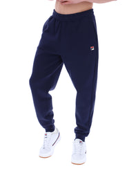 Displays the model wearing the Navy 'Fila' branded Visconti Tipped Cuff Track Pant