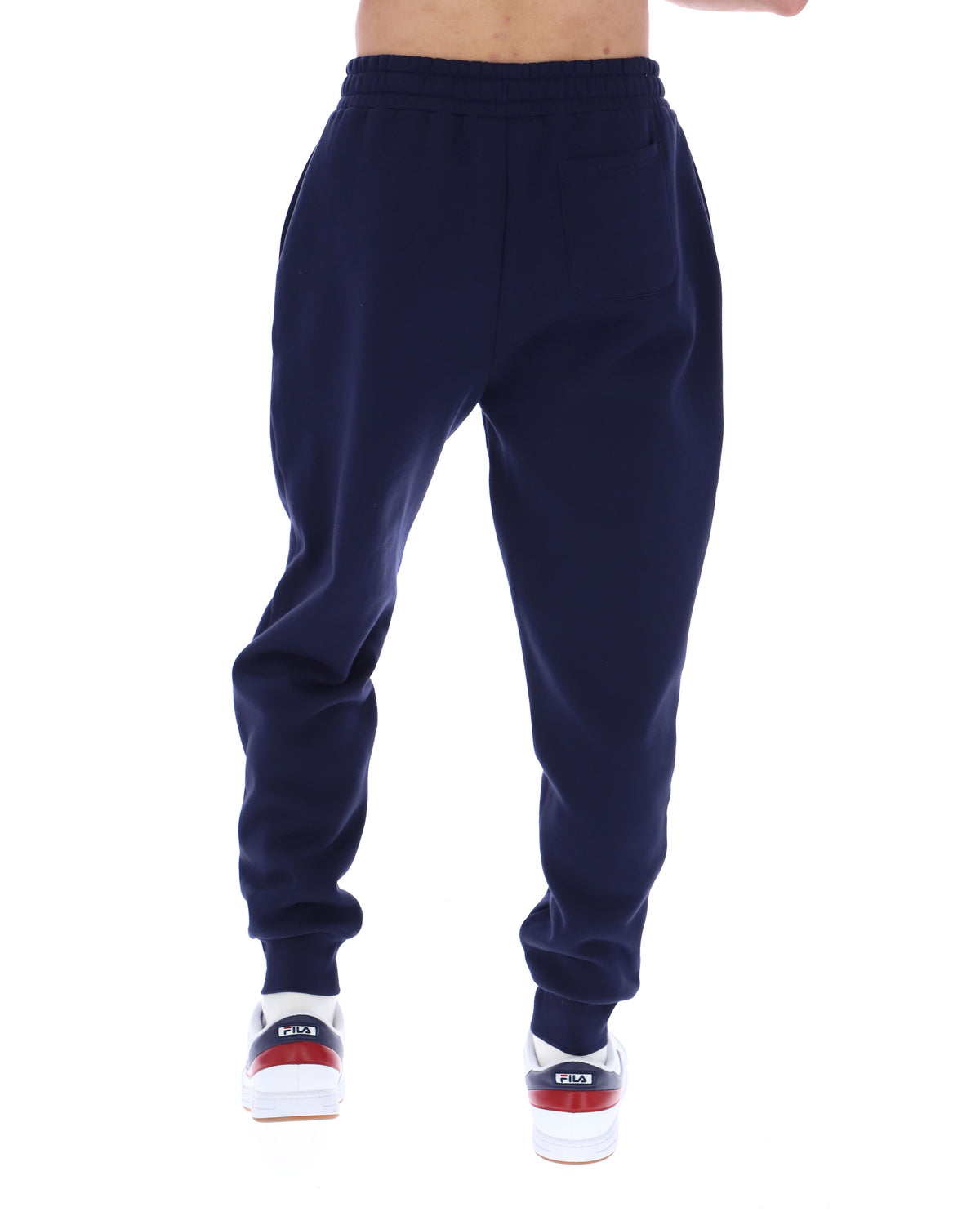 Displays the model wearing the Navy 'Fila' branded Visconti Tipped Cuff Track Pant