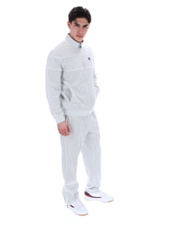 Displays a model wearing the Dawn Blue 'FILA' branded Vittorio Velour Track Top