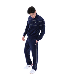 Displays a model wearing the Navy 'Fila' branded Vittorio Velour Track Top