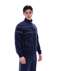 Displays a model wearing the Navy 'Fila' branded Vittorio Velour Track Top