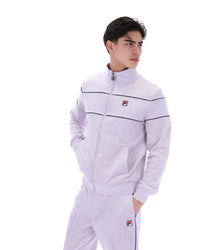 Displays a model wearing the Misty Lilac 'FILA' branded Vittorio Velour Track Top
