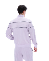 Displays a model wearing the Misty Lilac 'FILA' branded Vittorio Velour Track Top