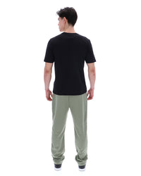 Displays a model wearing the Black 'Fila' branded Yaxley 4 Premium T-Shirt