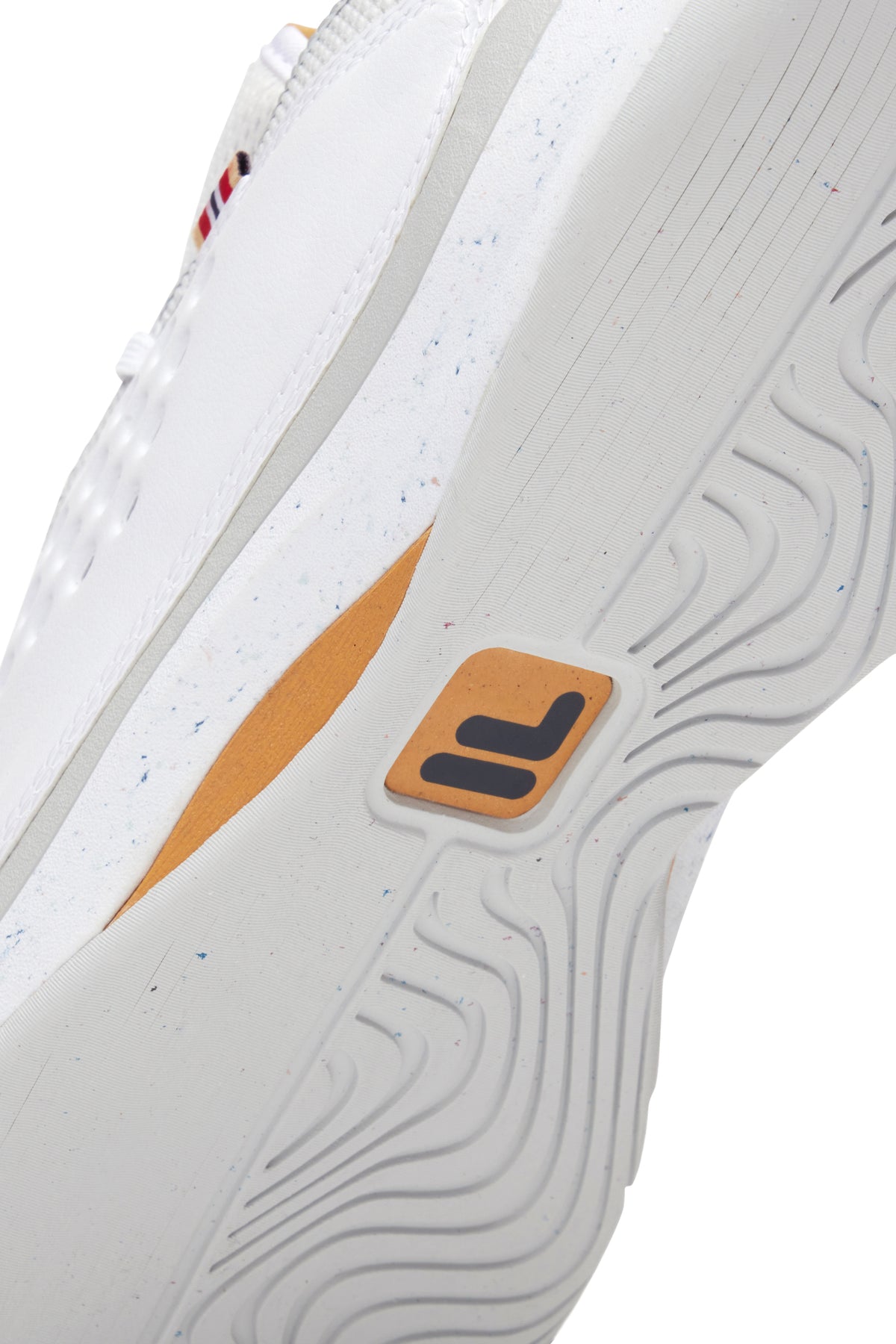 A pair of white FILA Mondo Forza tennis shoes with orange and grey accents on a white background.