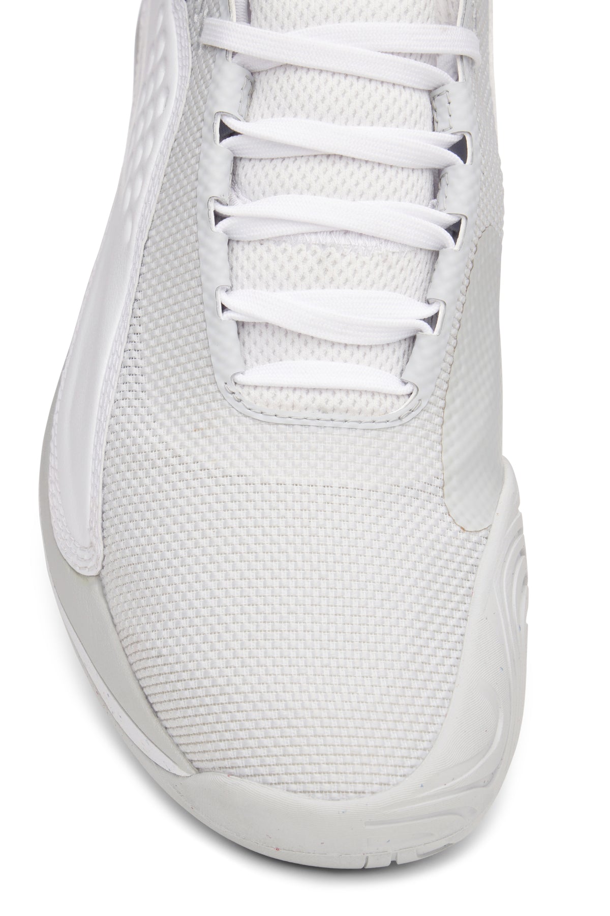 A pair of white FILA Mondo Forza tennis shoes with orange and grey accents on a white background.