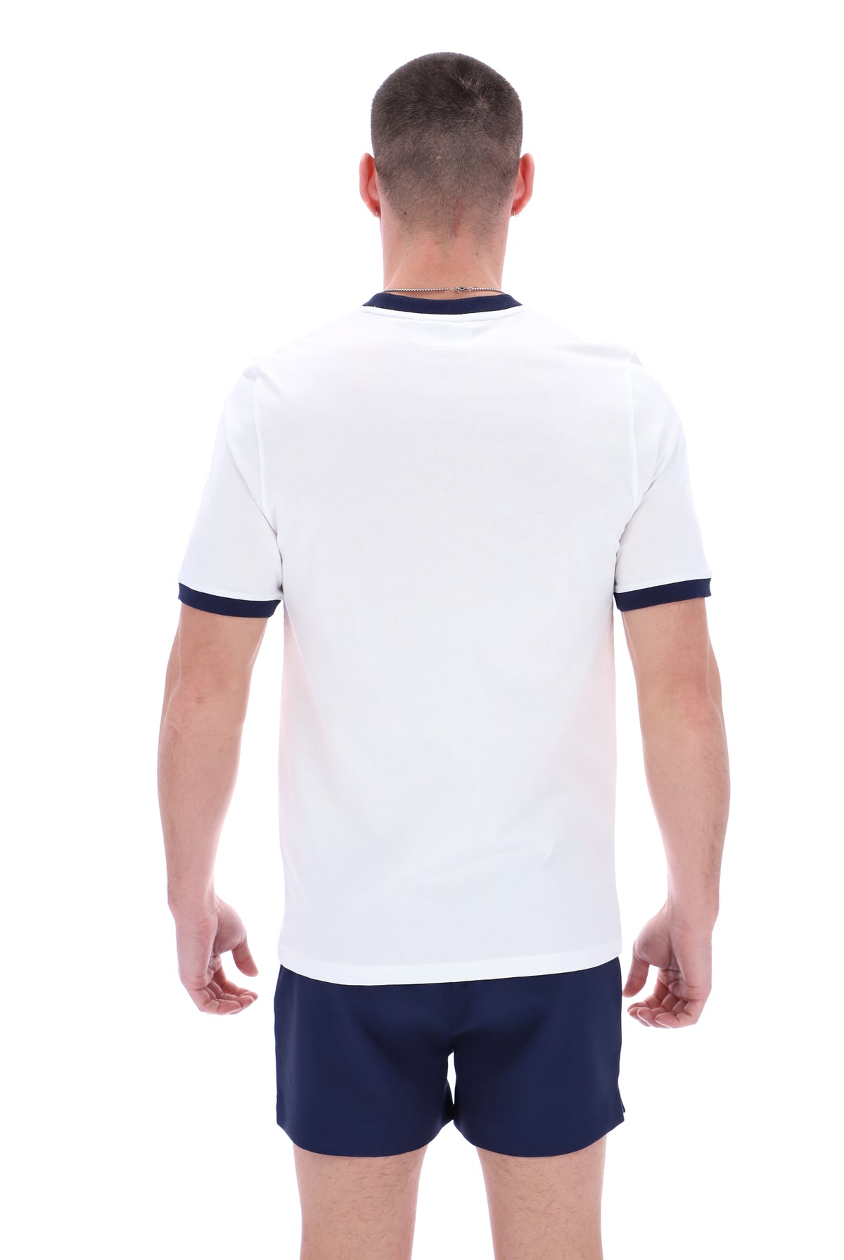 Displays a model wearing the White 'Fila' branded Marconi Essential Ringer T-Shirt