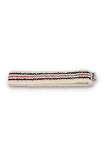 A beige retro headband with a red and blue stripe pattern and the FILA logo embroidered on it.
