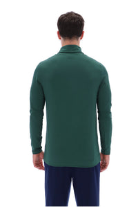 A man viewed from the back wearing a dark green long-sleeve mock neck shirt and navy blue pants, set against a plain white background.