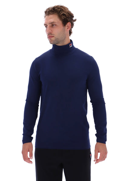 A man wearing a navy blue long-sleeve mock neck sweater, shown from the waist up against a plain white background.