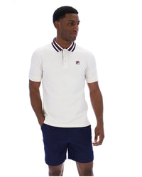 Displays a model wearing the Gardenia 'FILA' branded Achille Heritage Tape Basic Polo