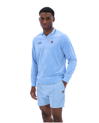 Displays a model wearing the Frozen 'FILA' branded Fjord Alfredo 1911 Velour Raglan Long-Sleeve Top