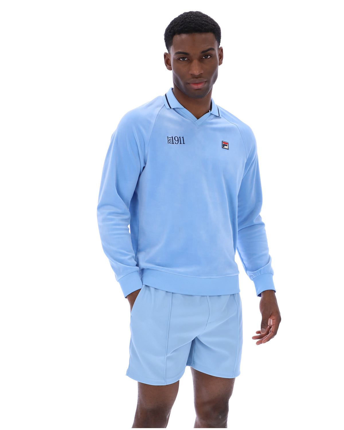 Displays a model wearing the Frozen 'FILA' branded Fjord Alfredo 1911 Velour Raglan Long-Sleeve Top