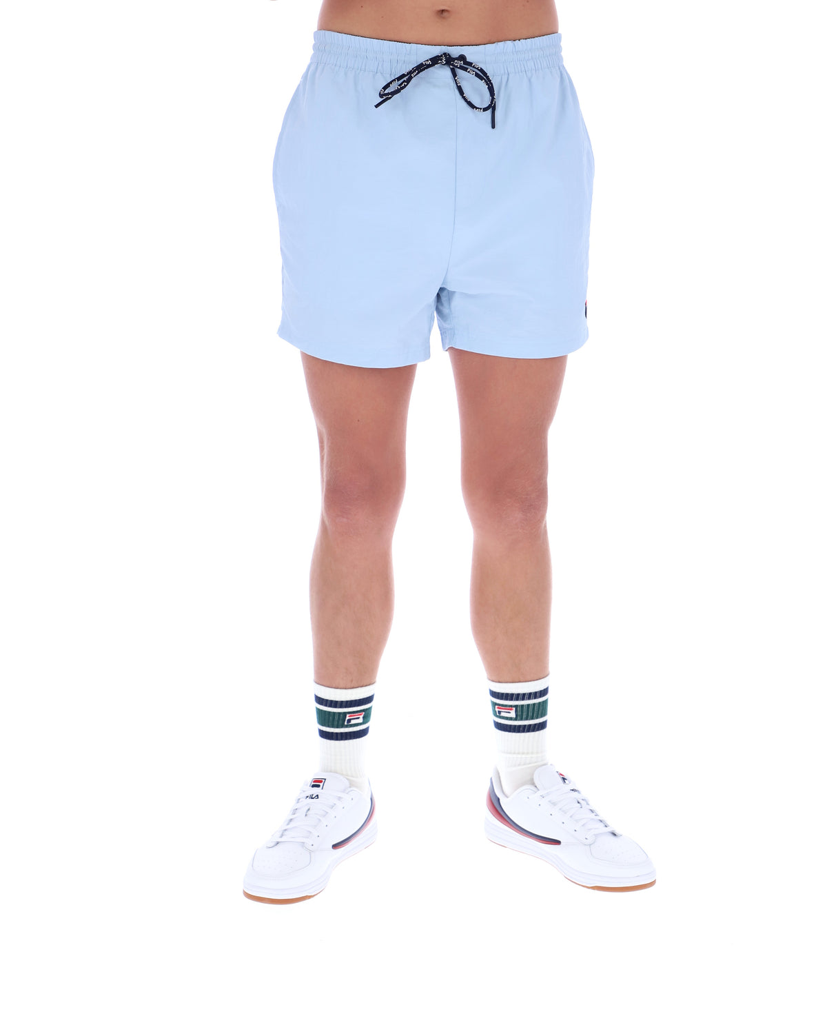 Light blue shorts worn by a person on a white background