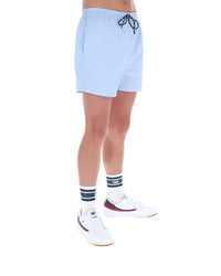 Light blue shorts worn by a person on a white background