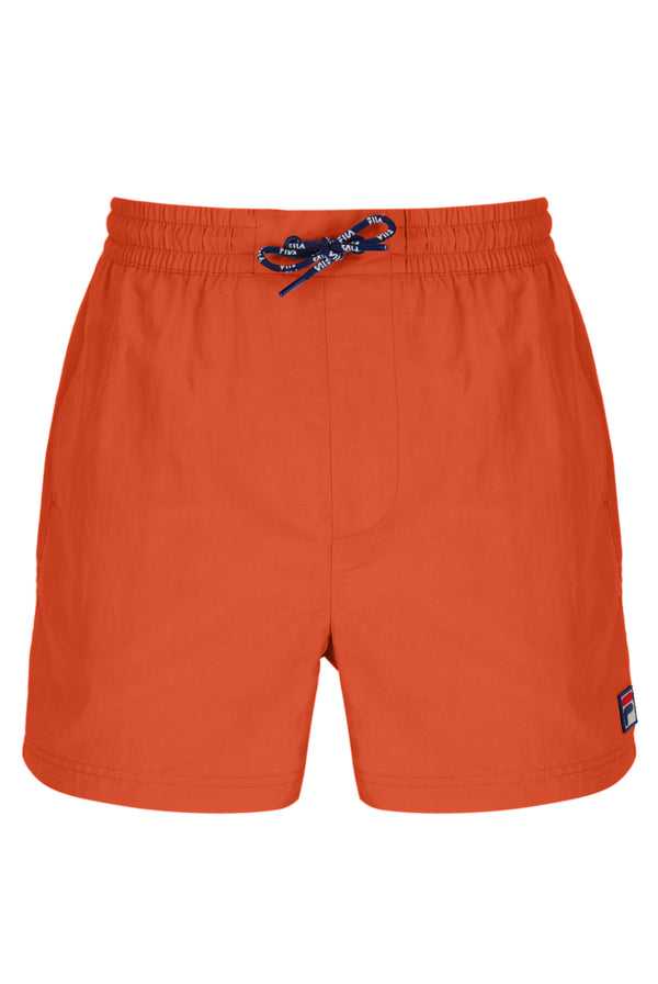 Orange shorts with a brand logo on a white background