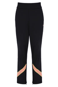 A pair of women's tennis track pants with colour blocks in peach pink and yellow on the sides, featuring an elastic waistband and branded with the FILA logo.