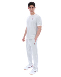 Man wearing a dawn blue t-shirt and pants with a logo on a white background