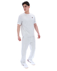 Man wearing a Dawn blue t-shirt and pants on a white background