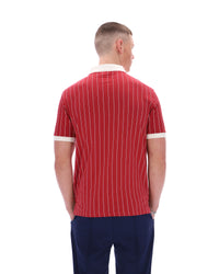 Man wearing a red striped polo shirt on a white background