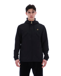 Man wearing a black pullover with a logo on a white background