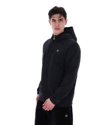 Man wearing a black hoodie with a small logo on a white background