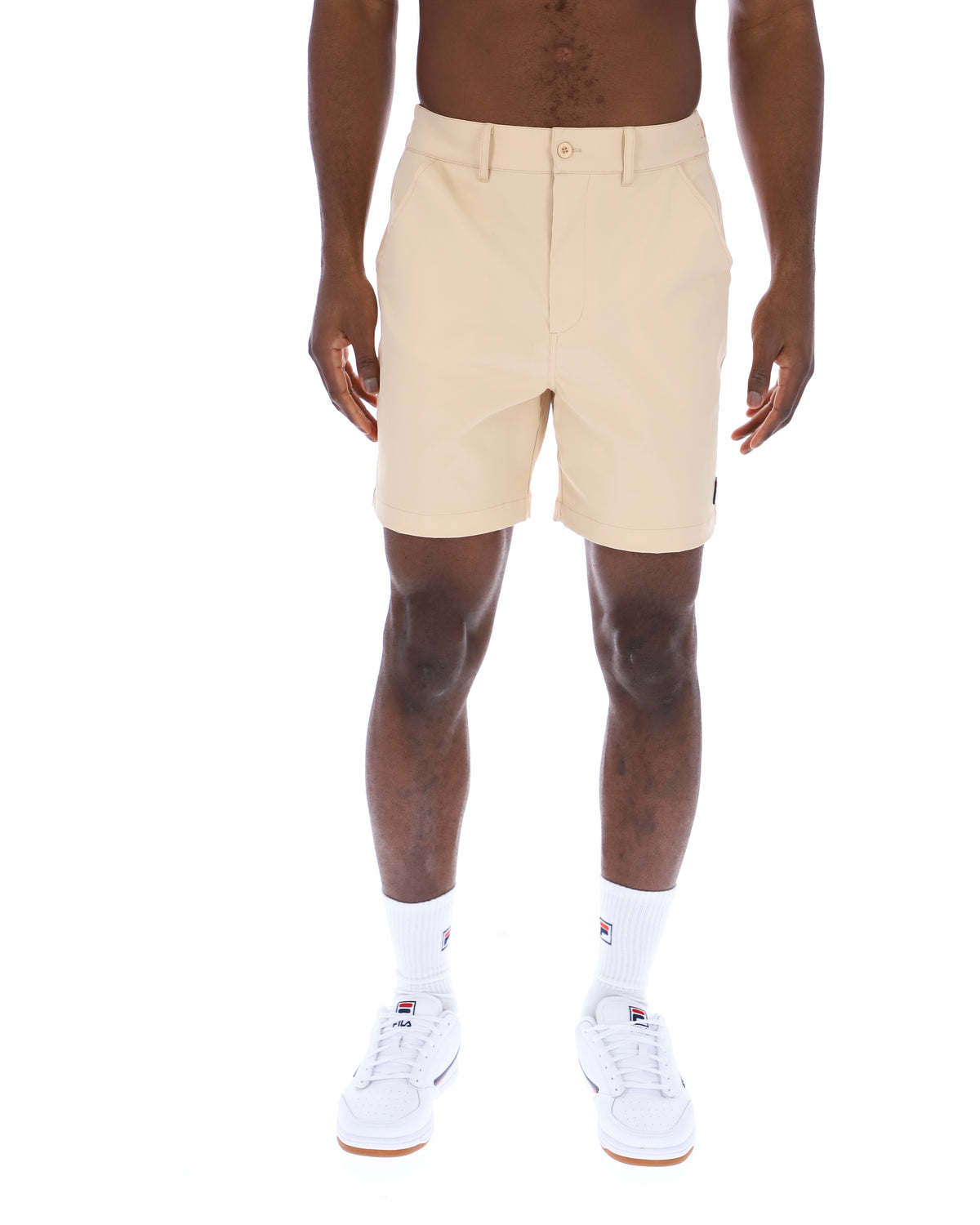 Displays a model wearing the Classic Beige 'FILA' branded Caruso Chino Shorts