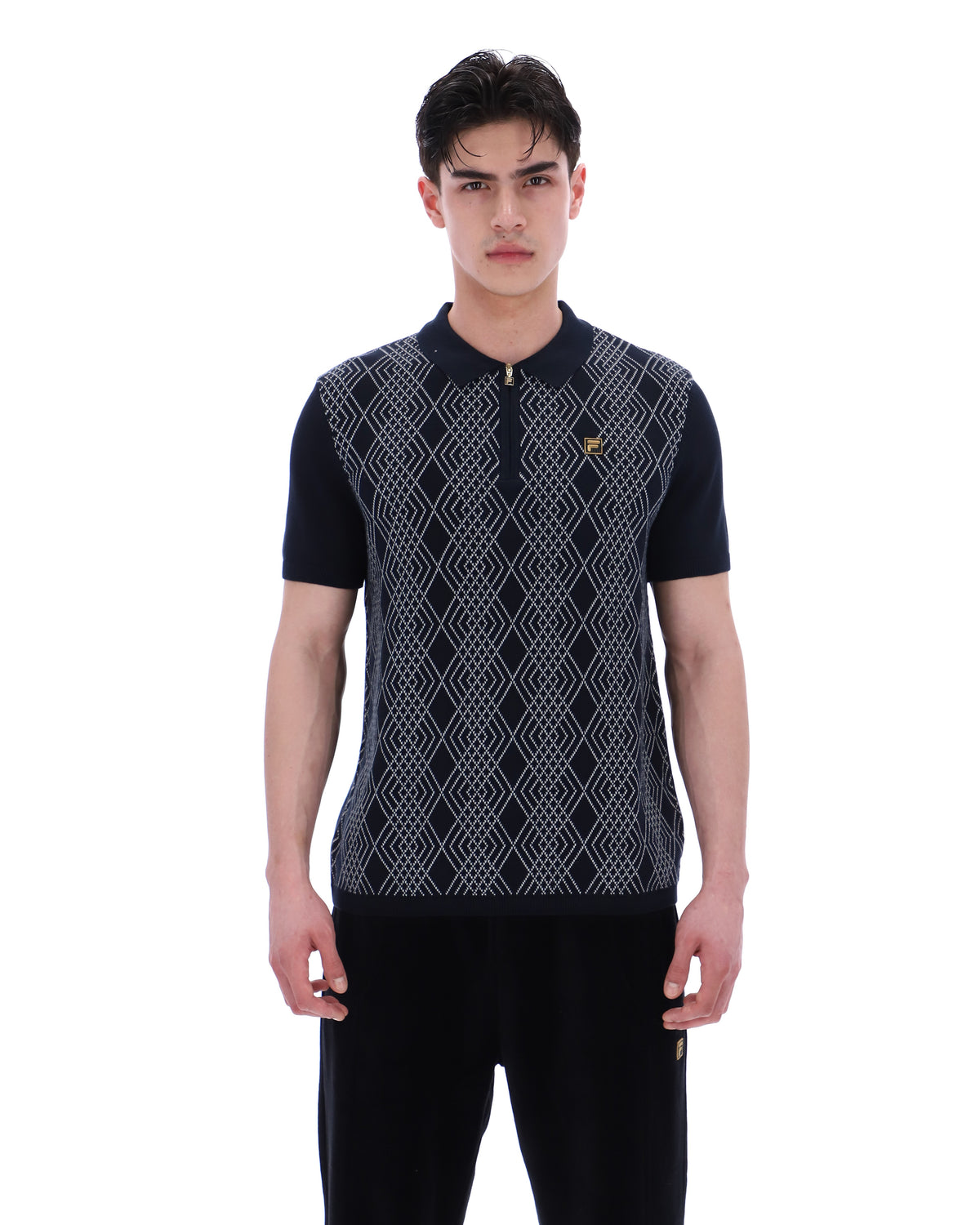 Man wearing a patterned polo shirt on a white background