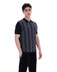 Man wearing a black and white patterned vest on a white background
