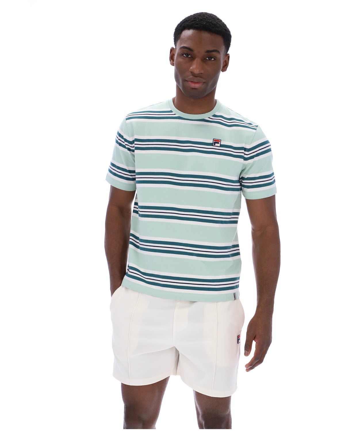 Man wearing a striped t-shirt and white shorts on a white background