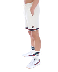 White shorts with red and blue trim worn by a person on a white background