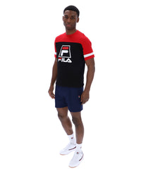 Displays a model wearing the Black 'Fila' branded Damon Cut and Sew Tee