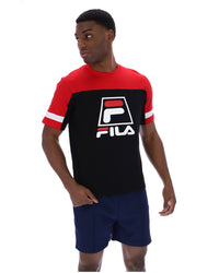 Displays a model wearing the Black 'Fila' branded Damon Cut and Sew Tee