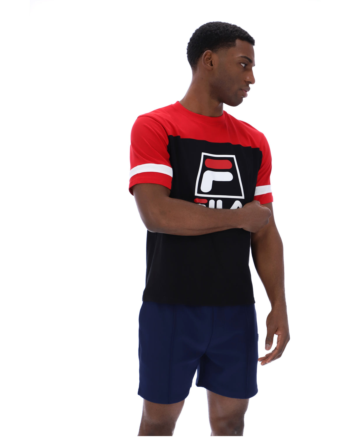 Displays a model wearing the Black 'Fila' branded Damon Cut and Sew Tee