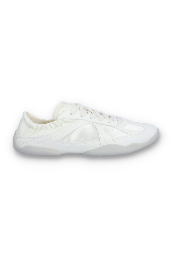 White Fila shoe on a white background.