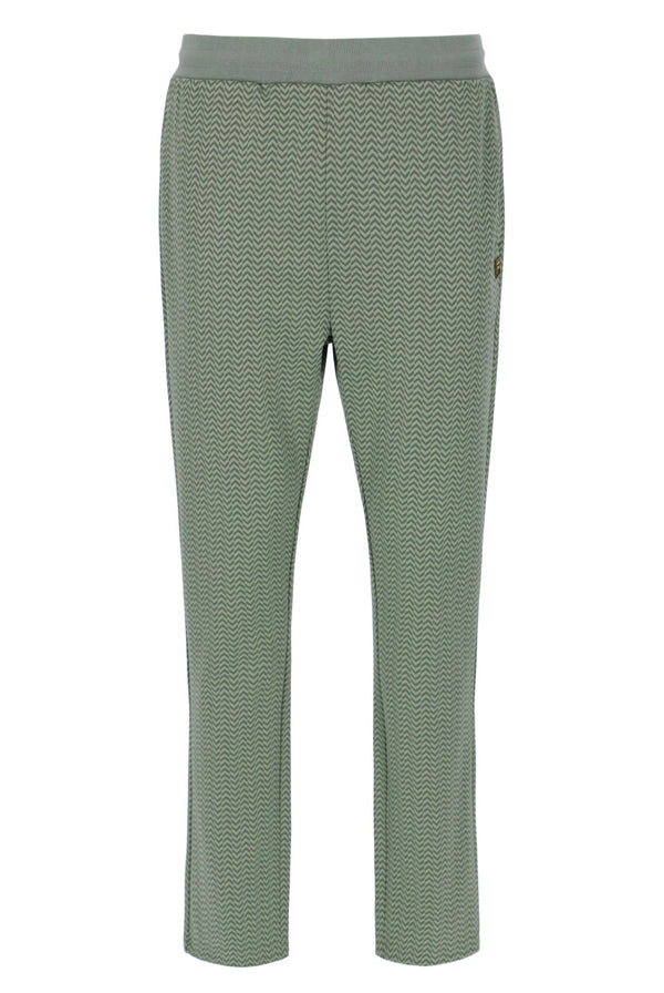 Displays a model wearing the Sea Foam 'FILA' branded Edward Herringbone Pant