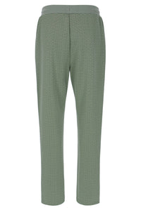 Displays a model wearing the Sea Foam 'FILA' branded Edward Herringbone Pant